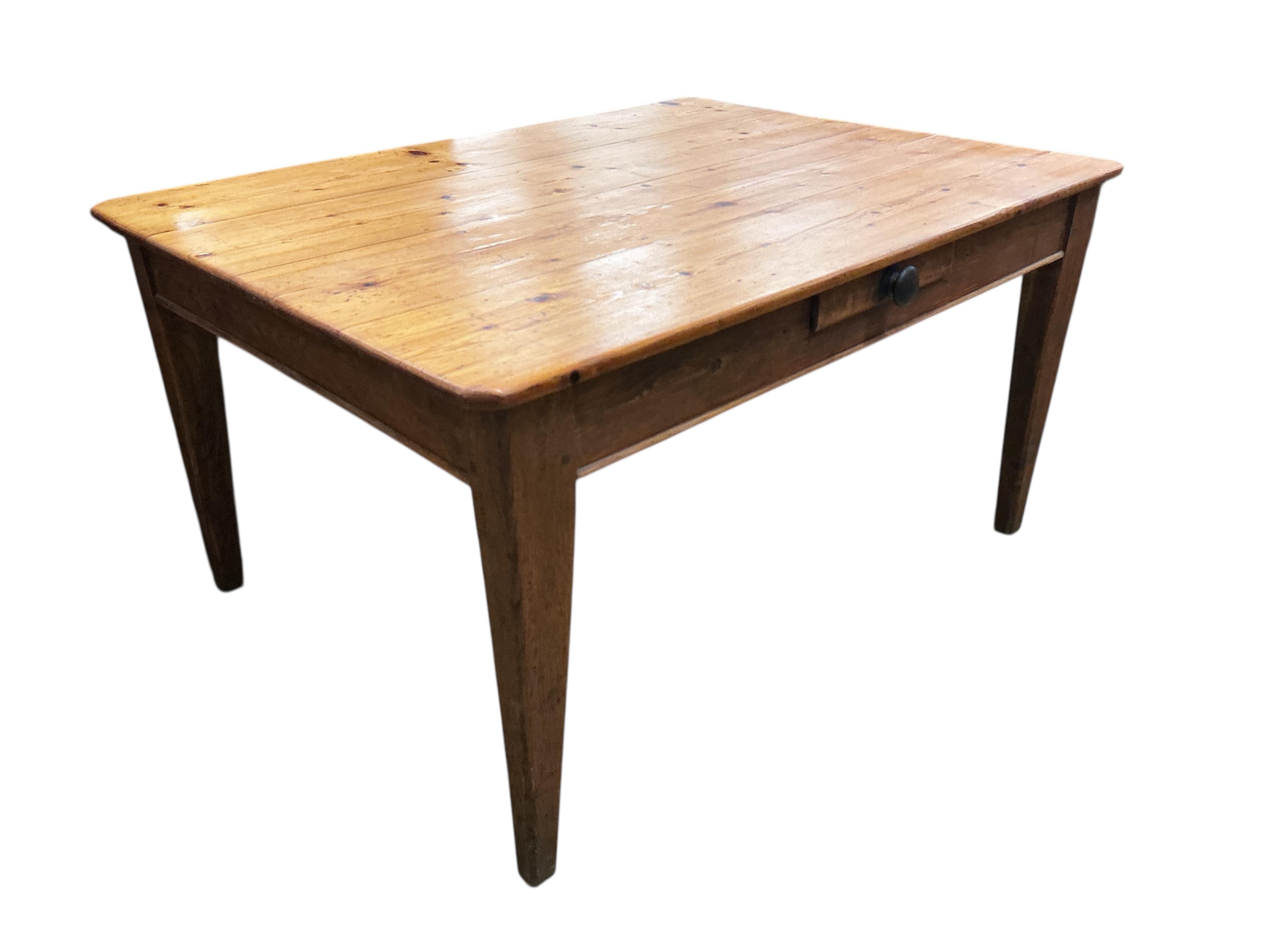 A mid 19th century rectangular pine kitchen table, fitted drawer on square tapered legs, width 136cm, depth 104cm, height 72cm